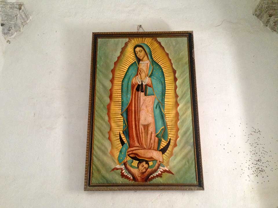 The Virgin of Guadeloupe, the patron saint of Mexico, adorning the wall of one of the ante-rooms in the Mission of San Javier.