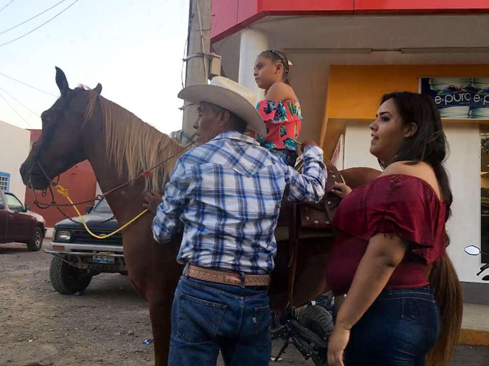 As we drove back through Mexico on Revolution Day Weekend, town after town had big celebrations going on. Grandpa and mom were helping this little girl get ready for a parade. 