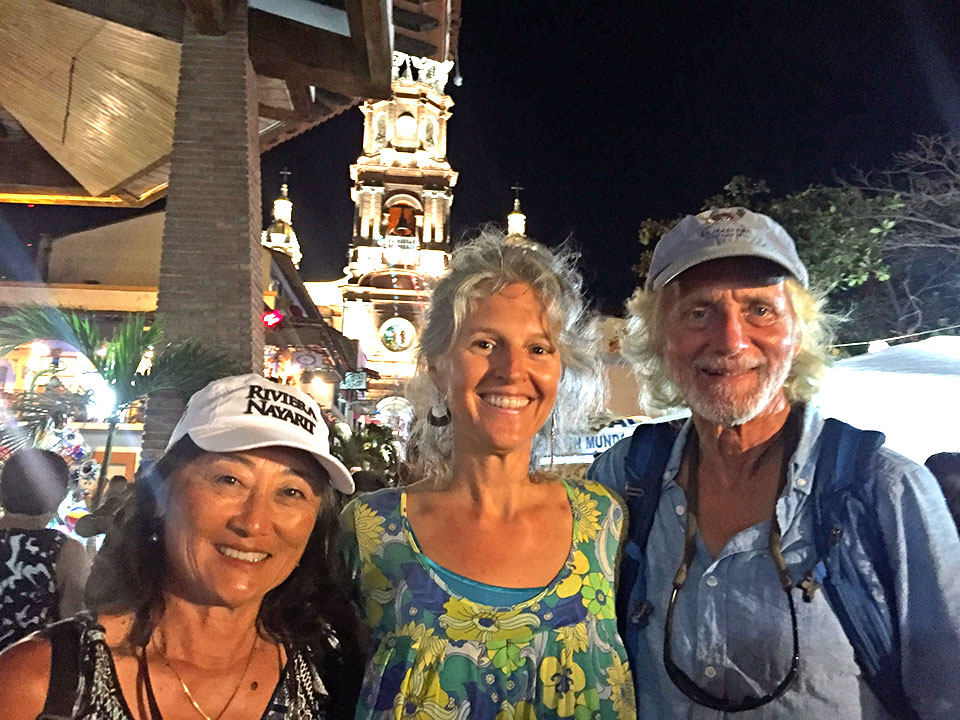 Sara, Heidi and Kirk at the Festival of Guadalupe... La Iglesia de Nuestra Senora de Guadalupe is lit up in the background.