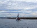 Crossing the Yaquina River Bar into Newport, Oregon, along with the fishing fleet.