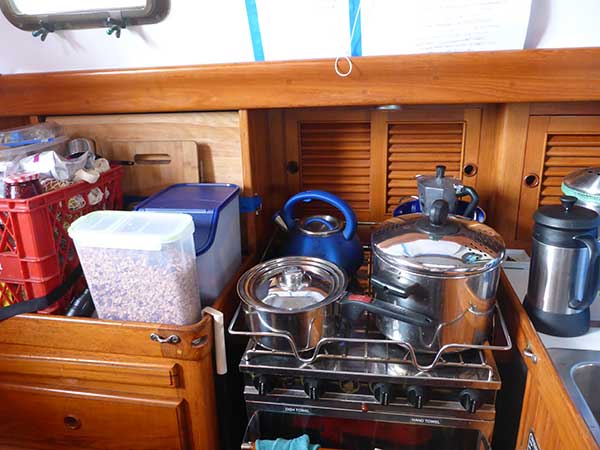 Stowed galley, including large container of home-made granola, courtesy of John.