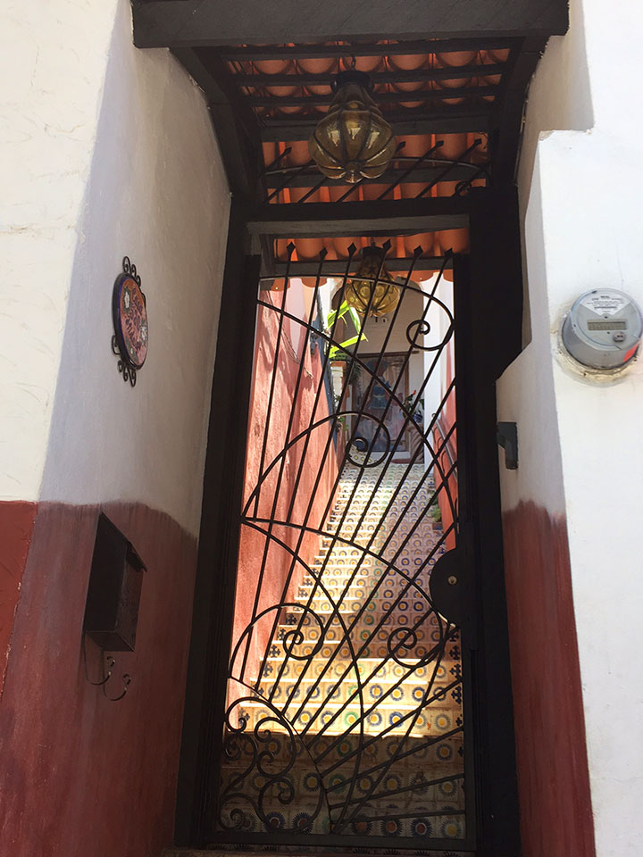 Most homes in PV have some type of decorative gate at the entrance...we though this one combined with the ceiling, doorway, tiles on stairs, and paint colors was particularly interesting. If you