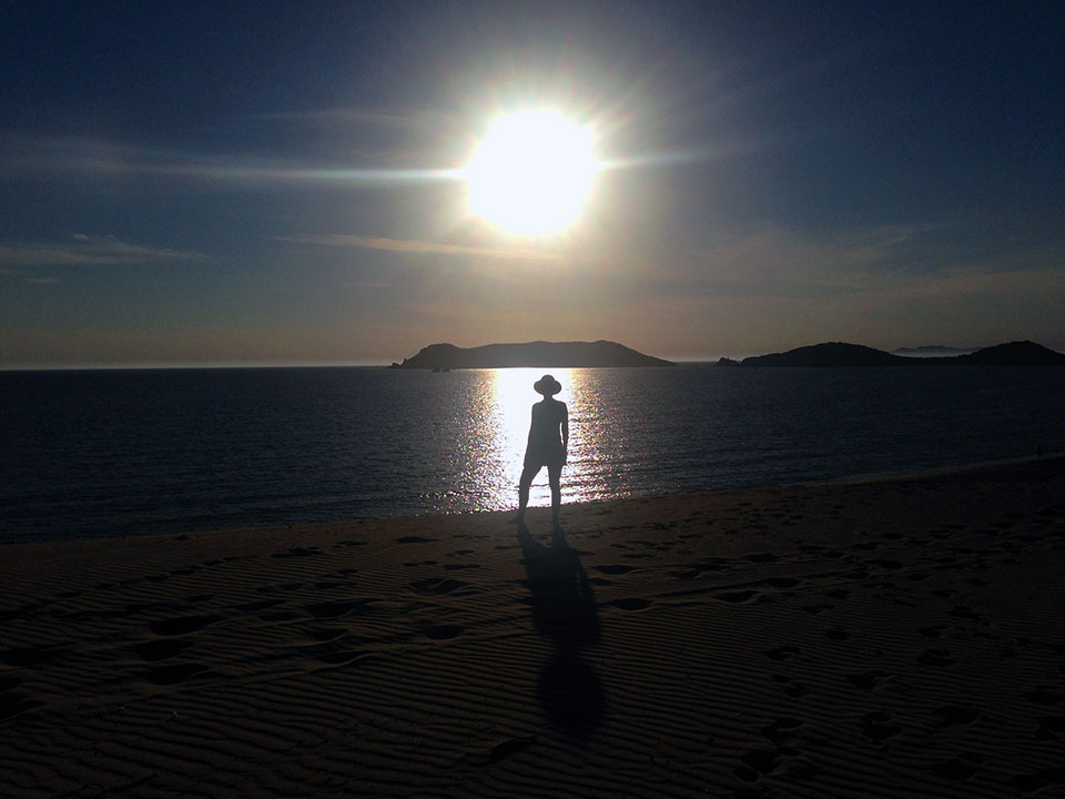Speaking of shadows, Kirk caught this photo of Heidi stealing the sunbeams on Playa Algodones. 