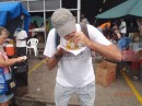 Gary eating Doubles at  the Port of Spain Market