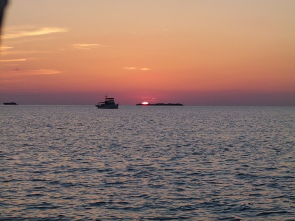 It was only us and this small trawler anchored off of the town. Another beautiful sunset. We didn