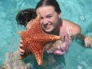 The beautiful Miss Annie showing off a large starfish found at Lee Stocking Island.  We didn