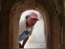 Bruce peeking through the confessional in the Spanish church ruins