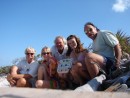 The crews of Sandy Annie and Te Oigo on Boo Boo Hill, Warderick Wells, Exumas, Bahamas
