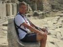 Jan seated on a stone carved seat at top of the Miletus theatre
