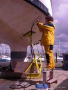 Steam cleaning the hull in the hope that it will speed up the process.