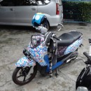 A well decorated motor scooter.