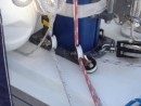 The new arrangement for the lines that raise the main sail.  The line on the left is the main line and the red is the backup just incase the main line should ever break.  It happens more times than you think.