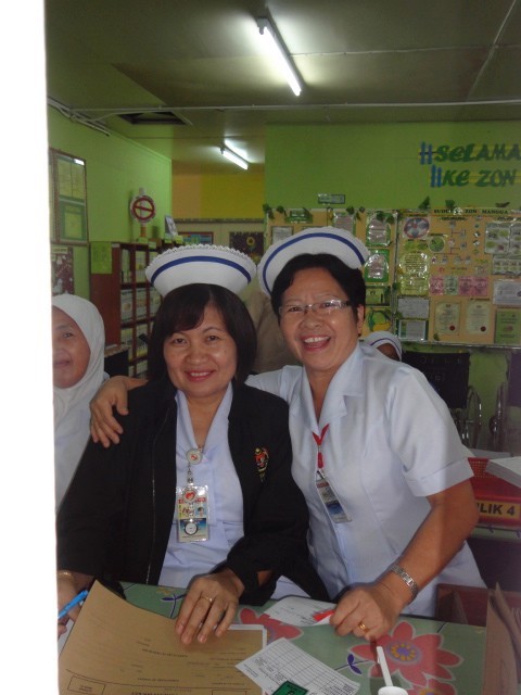 The nurse on the right is the one one that checked Tracy in for a checkup.  Nice bunch of happy women.