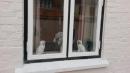 How much is that doggie in the window?: Dogs were placed in the windows. When the Captain is back from sea, the dogs face in. When the Captain is out at sea, they face out. Can
