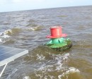 This is the Preferred Channel buoy located in the vicinity of 10-03.83N 062-09.17W. Since the topmost band is red, it should be honored as any lateral red buoy in IALA B region - when returning from seaward keep the buoy on your starboard hand.