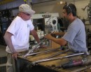 Keith the welding foreman and Tom discuss a stanchion repair.