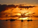 A spectacular sunset over the anchorage.  Islands of Raiatea, Tahaa and Bora Bora (L-R) 