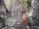 Enjoying a swim in the pool at the foot of the waterfall