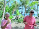Judy and Jan enjoying fresh coconut water - gifts from the family