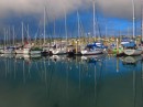 Moody morning in the marina with great reflections.