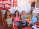 Anne and her friends selling their elastic bracelets at the school market.
