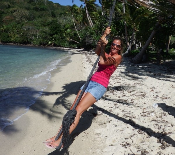 Monica swinging on the mooring line on Nananu-i-ra Island.