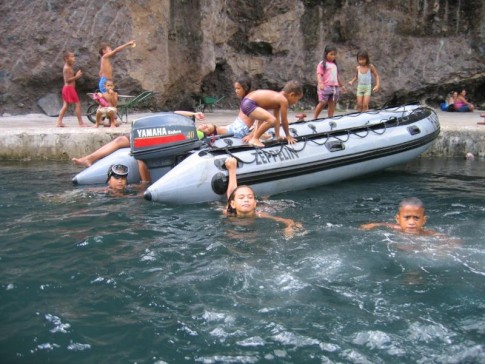 IMG_2224_1_1: Children hang out on the dingy at Fatu Hiva