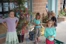 the cruising kids decorate the bamboo christmas tree at the marina