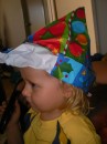 Joe modelling Christmas hat made from wrapping paper