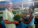 Bill buying home grown spinach Scarborough Tobago