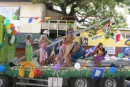 The "Yachts of Women of Courage" float!  Yes!  That is Glen in his grass skirt holding the whisker pole!  He was thankful there wasn