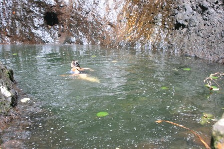 Sally swimming in pool at the base of the waterfall!