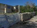 A stone fence and house on South Caicos Island