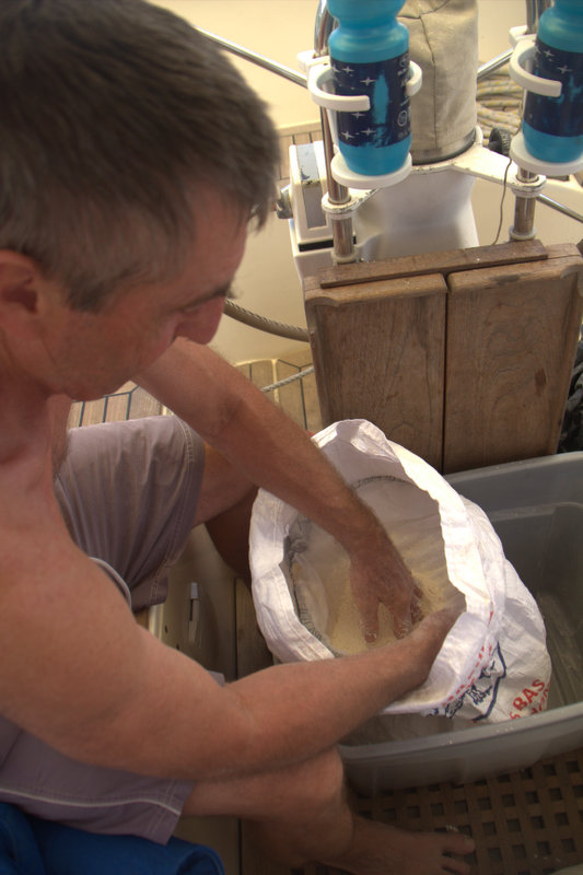 Andy sieving the flour to get rid of weevils!