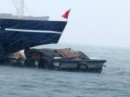 Barge blown onto a trip ship.