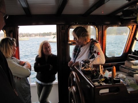 Lorraine, her mum (Bron) and Sue aboard Heimkehr: in the wheelhouse. How we long for a wheelhouse when it is cold and wet :-)