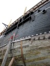 Looking up from the level of the keel of the whaling ship, the Charles W. Morgan