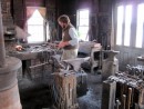 Blacksmith at work making ships nails.