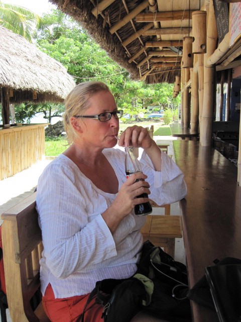 Sue enjoying a coke in hot humid conditions