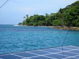 View across one of our solar panels at Sapzurro. Lush tropical vegetation, the rain came later