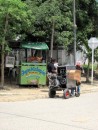 This ice cream vendor has a petrol driven engine plus compressor for the freeser on his wheeled display barrow