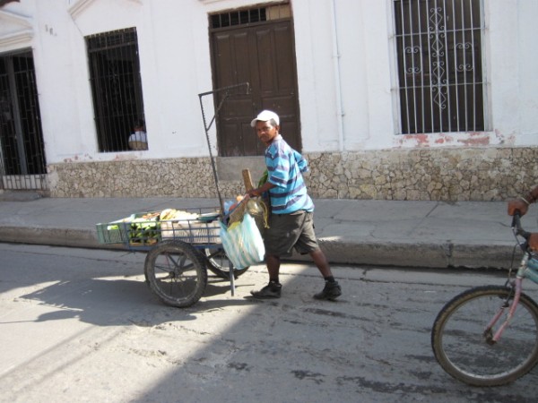 Many street traders operating from barrows or hand carried trays.