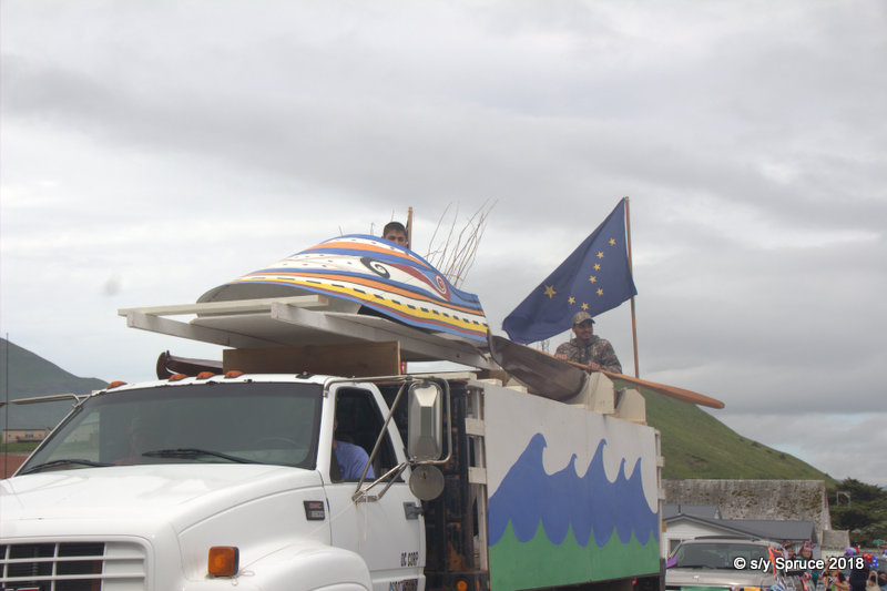 one of the parade floats repesenting a traditional Aleut fishing helmet.