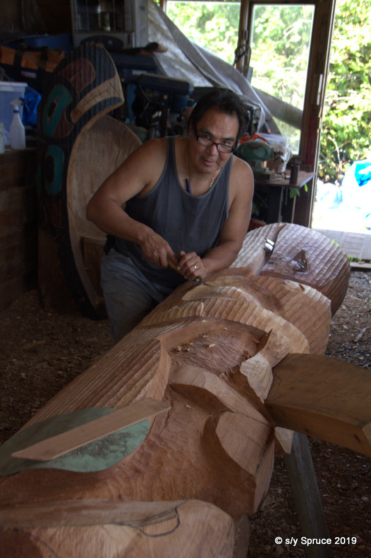Master Carver Sanford Williams at his workshop in Friendly Cove.