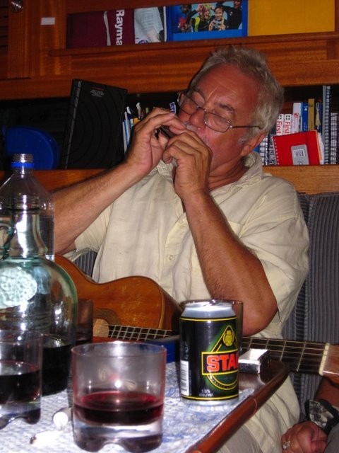 Phil in full throw on the Harmonica.