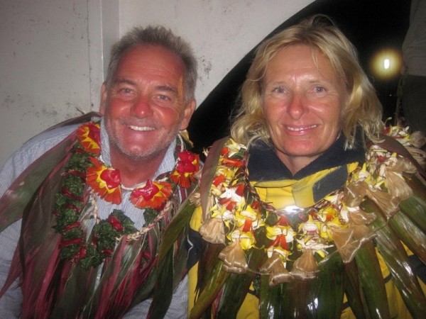 Bill and Caroline decorated with flower leas after the feast.