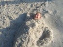 John the Mermaid buried in the sand