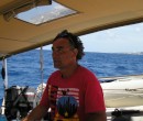 Paul at the helm of Eira.JPG