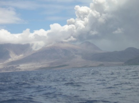 The volcano is erupting as we are sailing by, there is liquified ash which reaches all the way down to the waters edge!