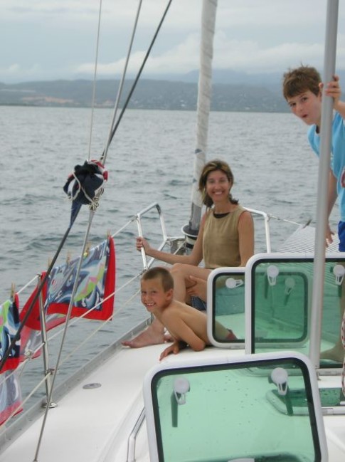 Laura, John and Luke on deck sailing to Coffin Island.